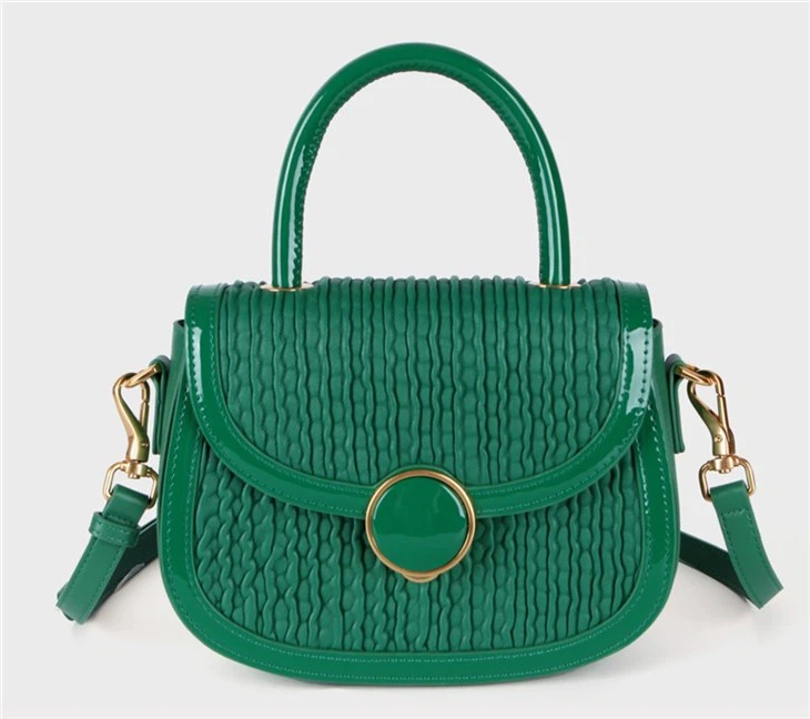 green leather handbag